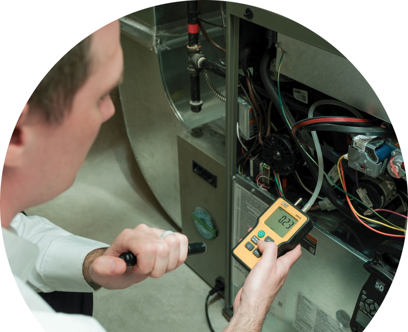 Shines HVAC specialist performing furnace repair on a heating sy