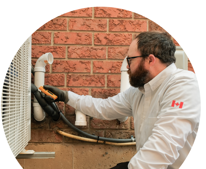 Shines HVAC specialist checking insulated piping on a heat pump unit beside a brick wall during a diagnostic service.