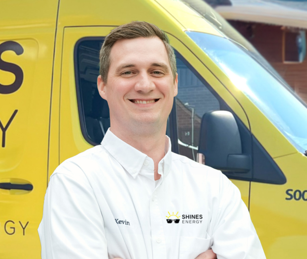 Smiling Shines technician standing confidently in front of their green service van, wearing their white issued uniform. Smiling Shines technician standing confidently in front of their green service van, wearing their white issued uniform.